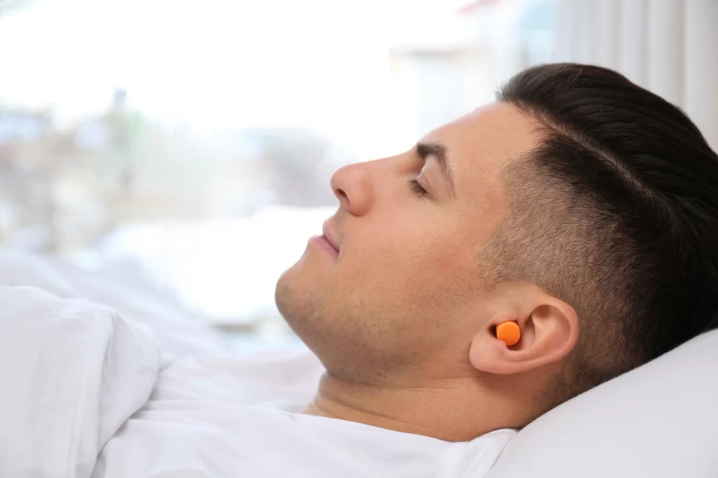 sleep with earplugs